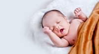 L'Effondrement Démographique en France Un Appel à la Sortie de l'Union Européenne - baby lying on white fur with brown blanket